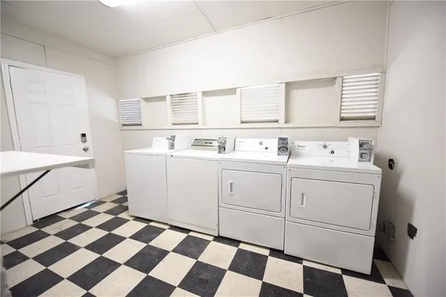 a utility room with a sink a washer and dryer