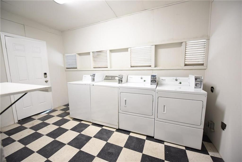 4612 Junius Street, Unit B Dallas, TX 75246 - Photo 10 of 14 a utility room with a sink a washer and dryer
