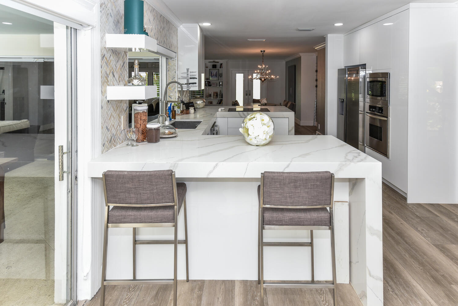 880 Hickory Terrace Boca Raton, FL 33486 - Photo 11 of 38 a kitchen with a table and chairs in it