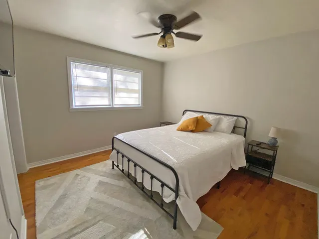 a bedroom with a bed and window