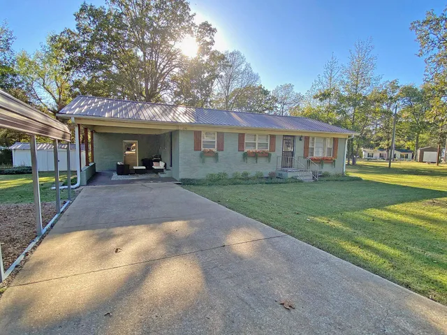 a bedroom with a bed and flat screen tv