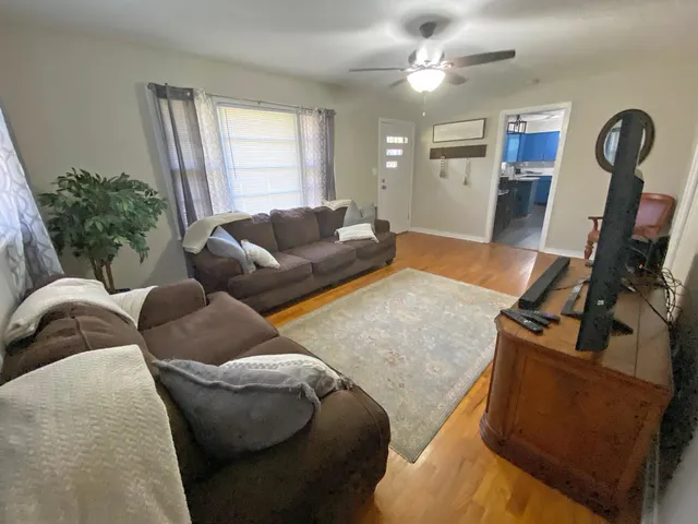 a living room with furniture and a window