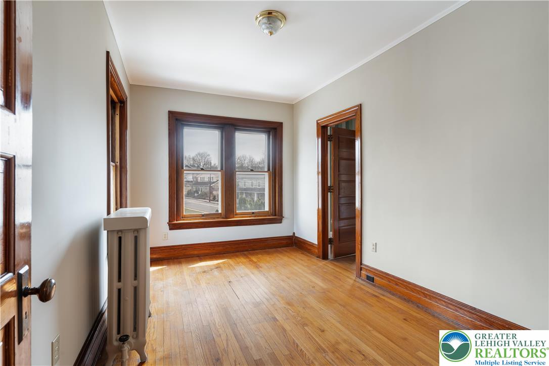 4349 Main Street Whitehall, PA 18052 - Photo 25 of 42 an empty room with wooden floor and windows