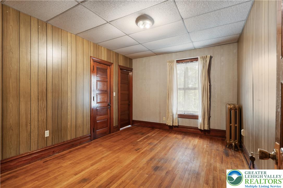 4349 Main Street Whitehall, PA 18052 - Photo 26 of 42 an empty room with wooden floor and windows