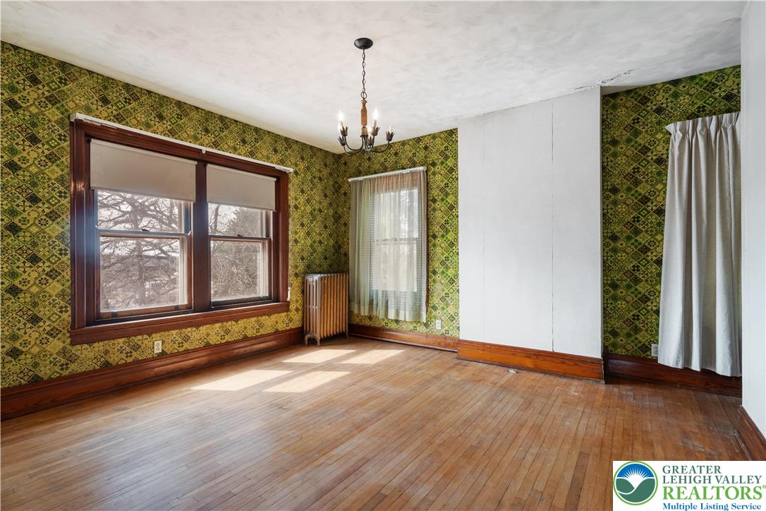 4349 Main Street Whitehall, PA 18052 - Photo 30 of 42 an empty room with wooden floor and windows