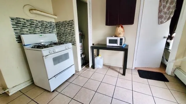 a kitchen with washing machine and a sink