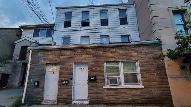 a front view of a house with glass windows