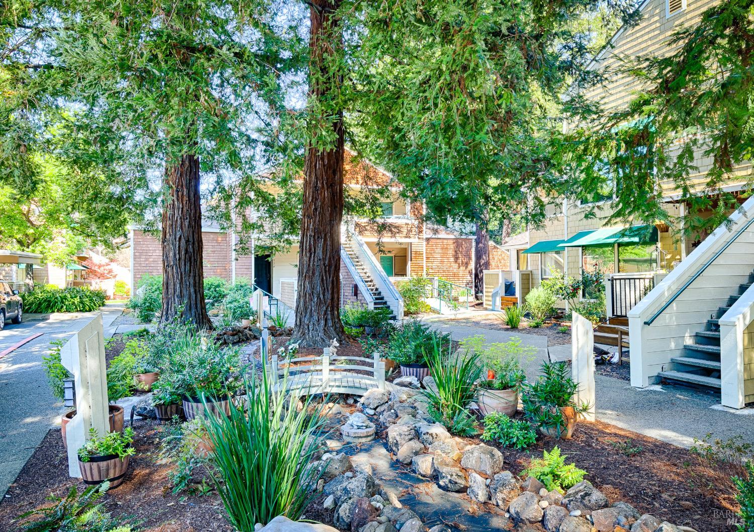 901 Russell Avenue, Unit 136 Santa Rosa, CA 95403 - Photo 1 of 34 Front of the unit from the tranquilly landscaped common area. The unit for sale is the one with the ramp.