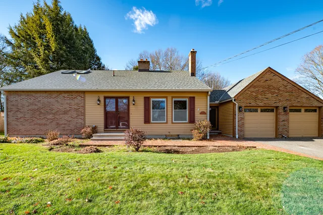 front view of a house with a yard