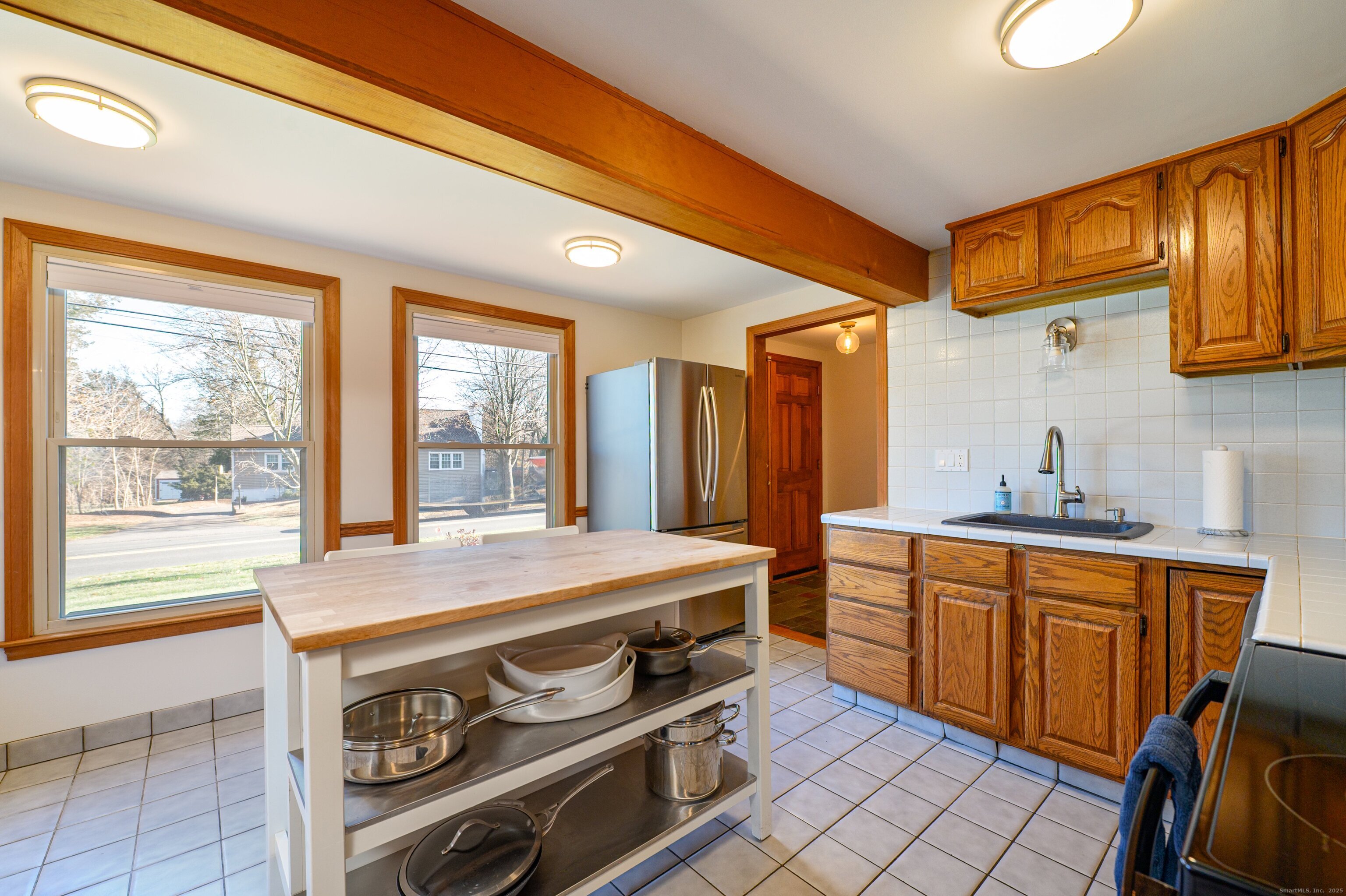 975 Wolf Hill Road Cheshire, CT 06410 - Photo 12 of 40 a room with stainless steel appliances a stove a sink and cabinets