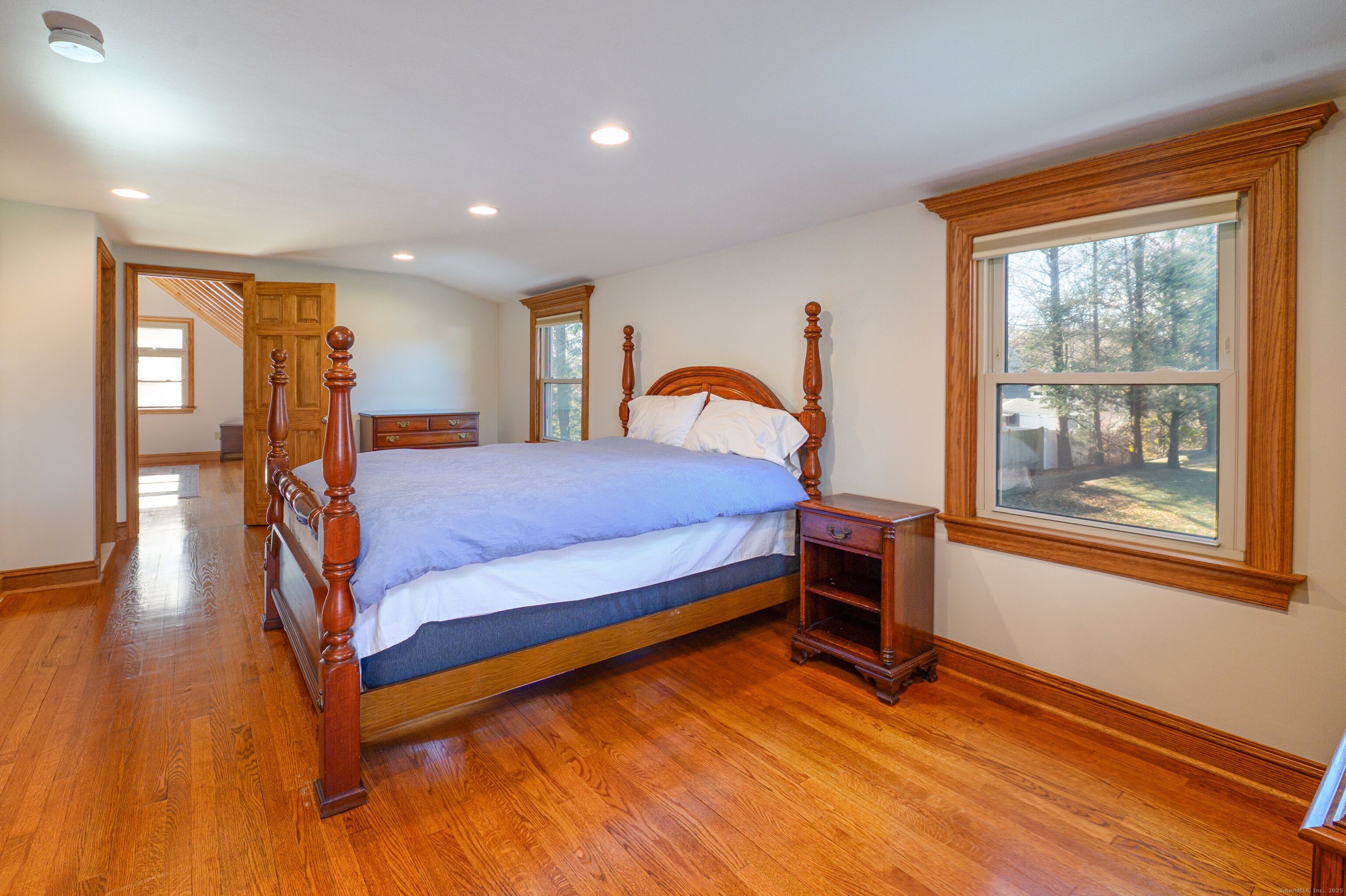 975 Wolf Hill Road Cheshire, CT 06410 - Photo 19 of 40 a bedroom with a bed and wooden floor