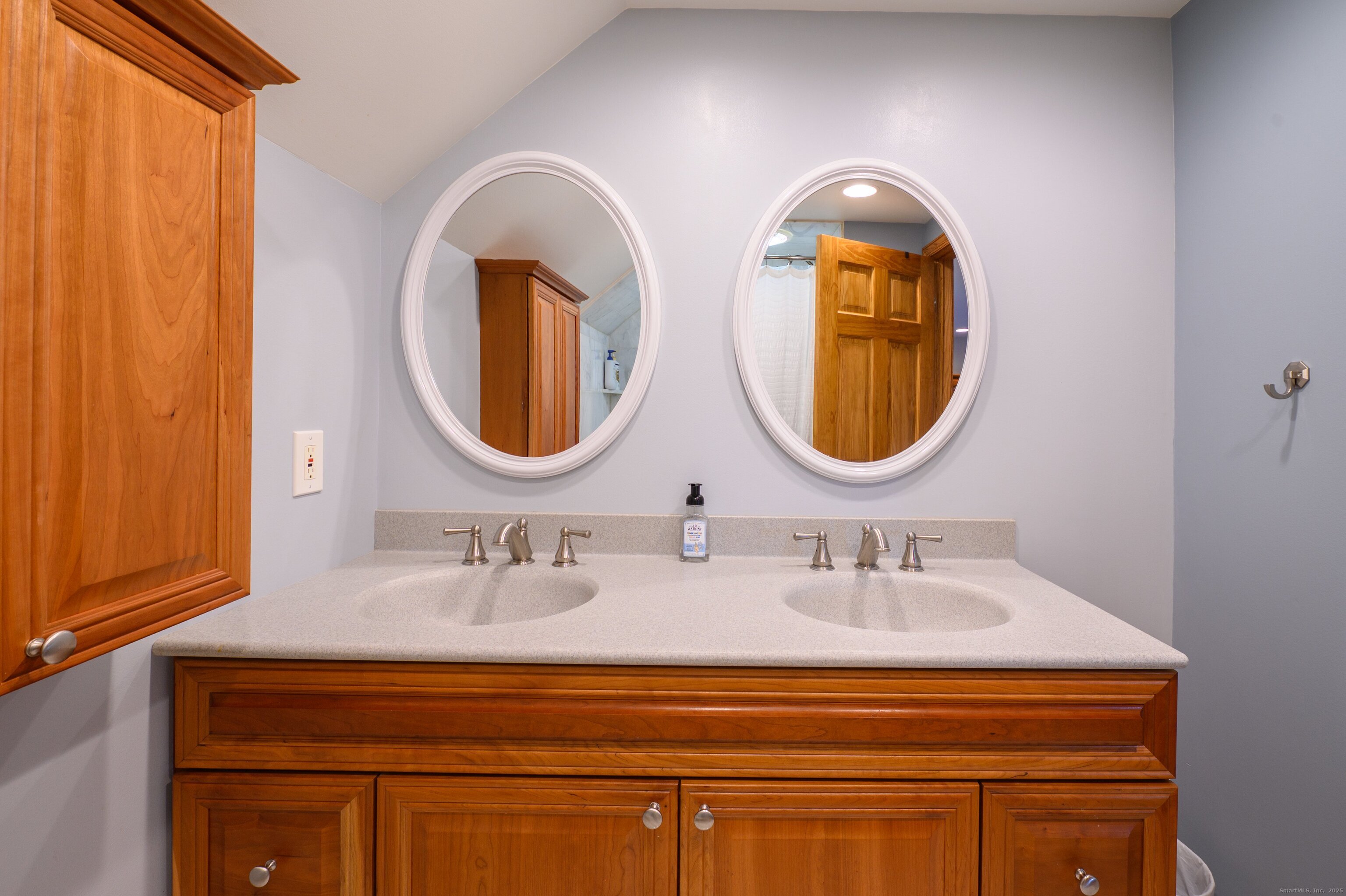 975 Wolf Hill Road Cheshire, CT 06410 - Photo 22 of 40 a bathroom with a sink and a mirror