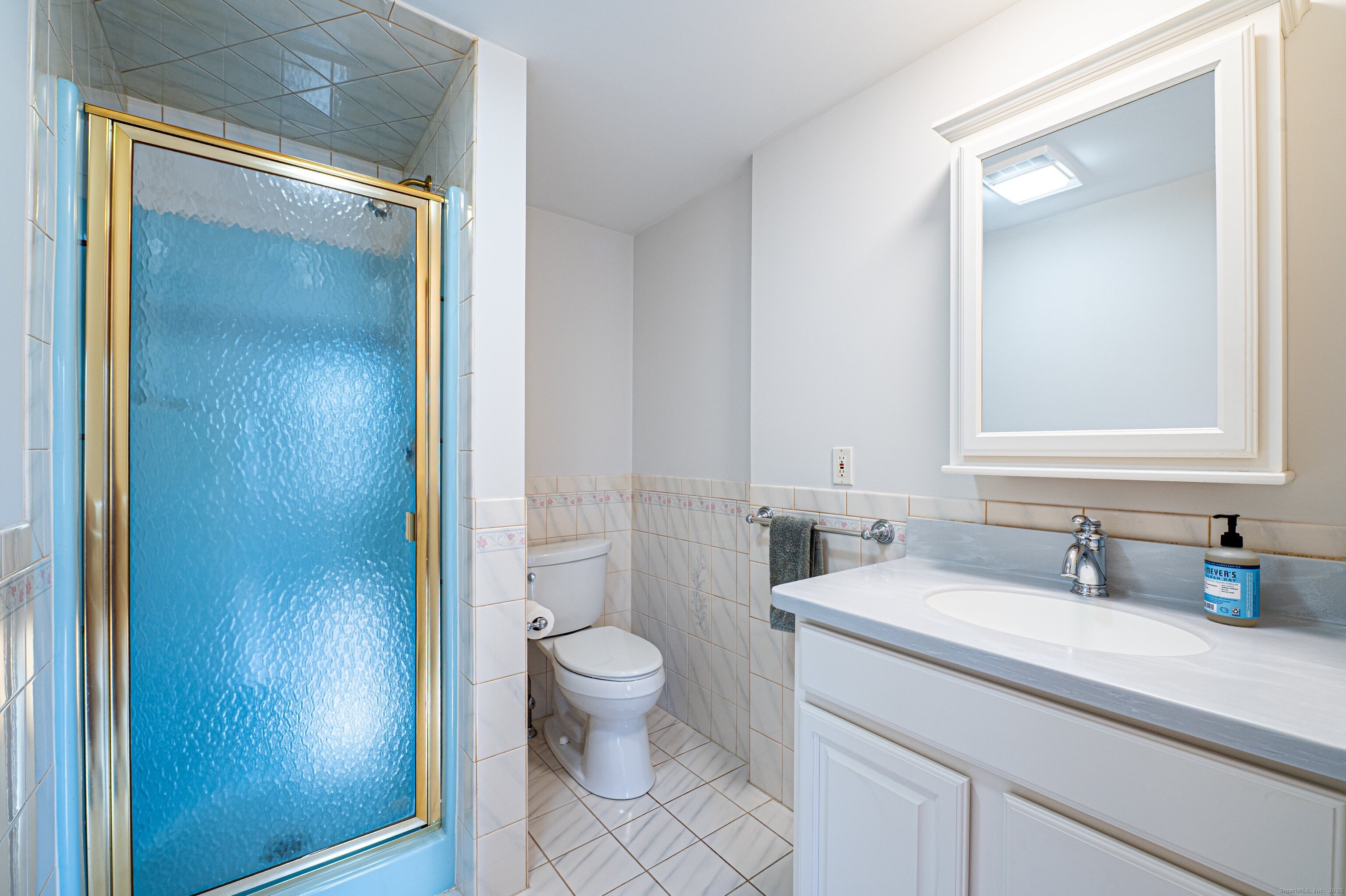 975 Wolf Hill Road Cheshire, CT 06410 - Photo 28 of 40 a bathroom with a sink a toilet and shower