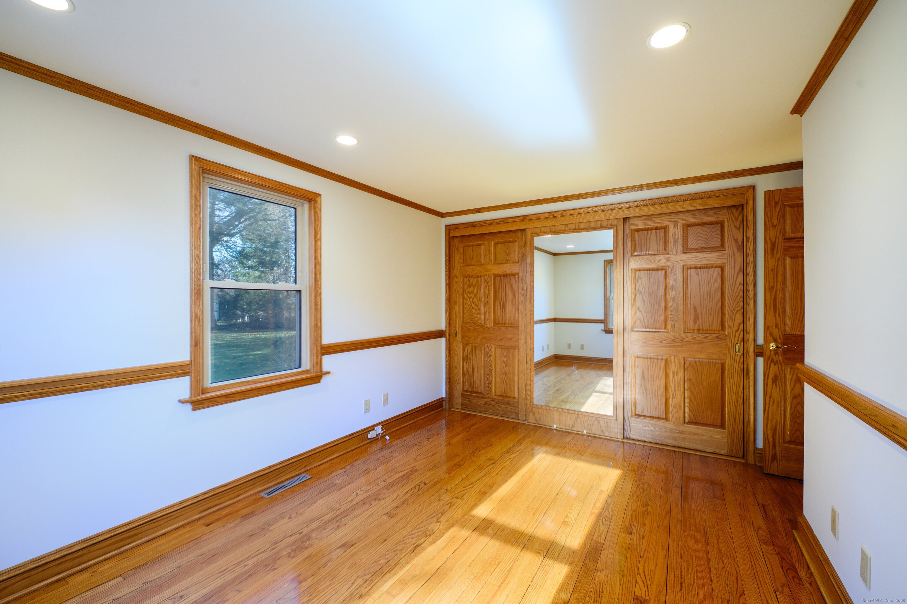 975 Wolf Hill Road Cheshire, CT 06410 - Photo 29 of 40 a room with window and wooden floor