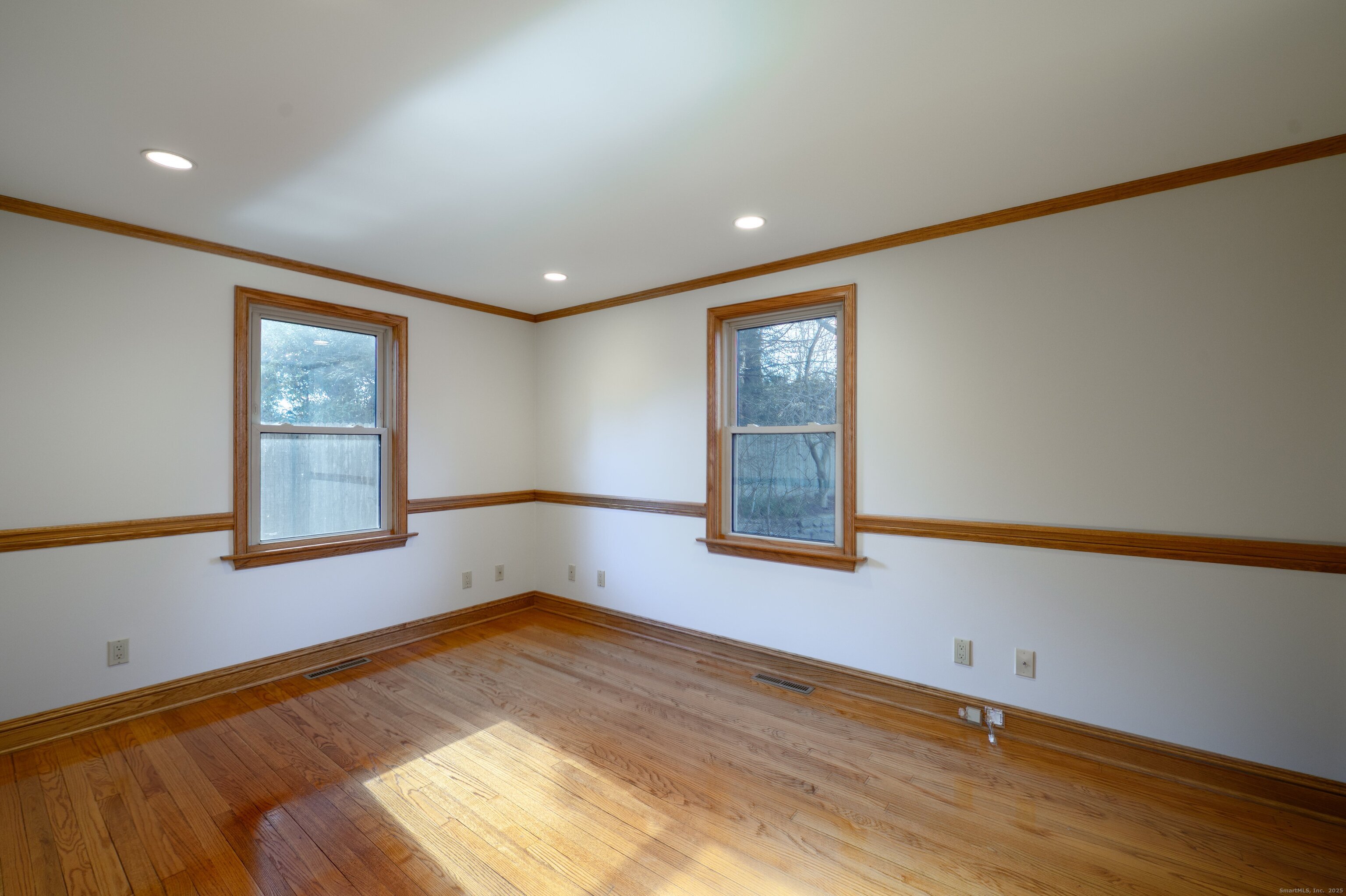 975 Wolf Hill Road Cheshire, CT 06410 - Photo 30 of 40 a view of empty room with wooden floor and fan