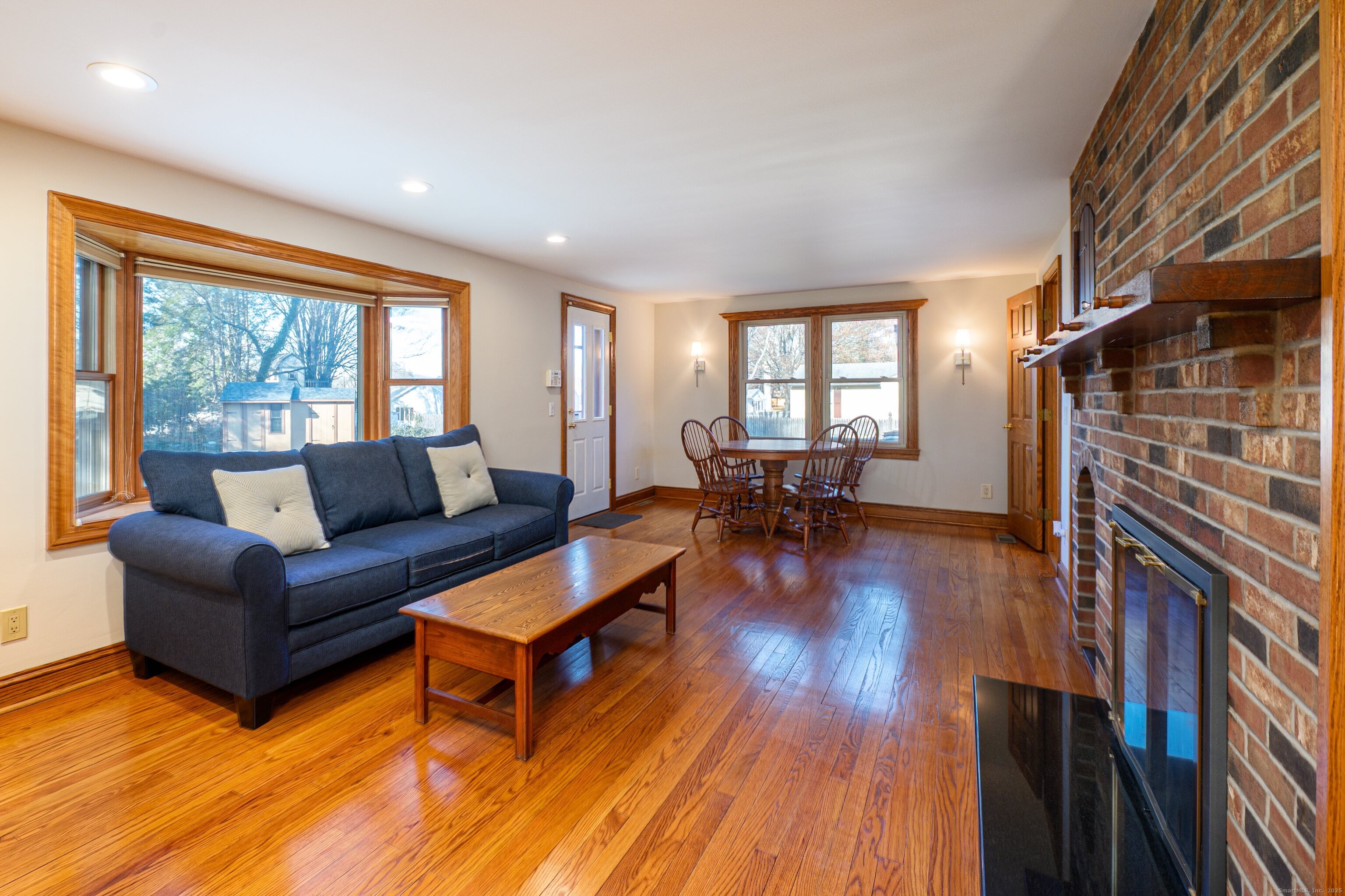 975 Wolf Hill Road Cheshire, CT 06410 - Photo 3 of 40 a living room with furniture and a wooden floor