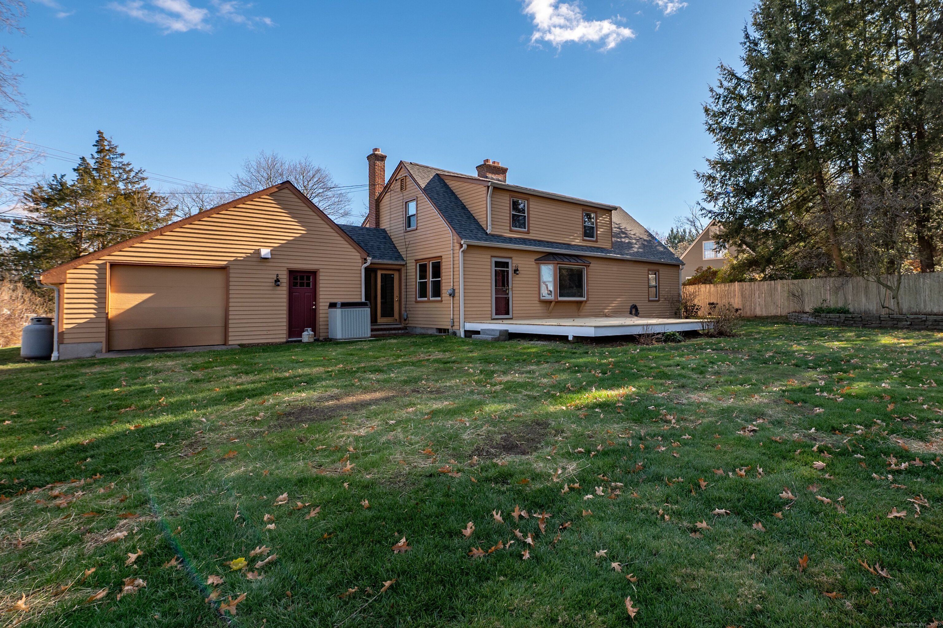 975 Wolf Hill Road Cheshire, CT 06410 - Photo 32 of 40 a view of a house with a big yard and large trees