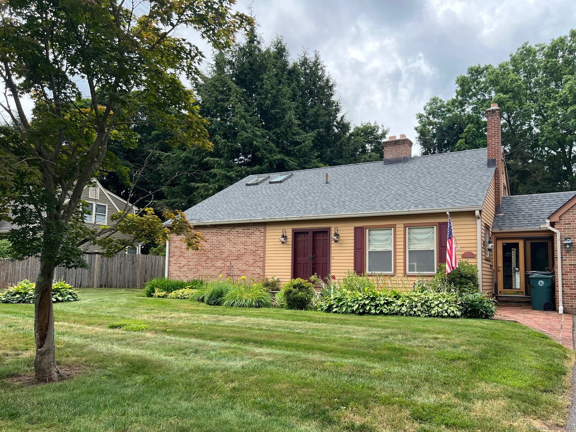 975 Wolf Hill Road Cheshire, CT 06410 - Photo 39 of 40 a front view of a house with a yard