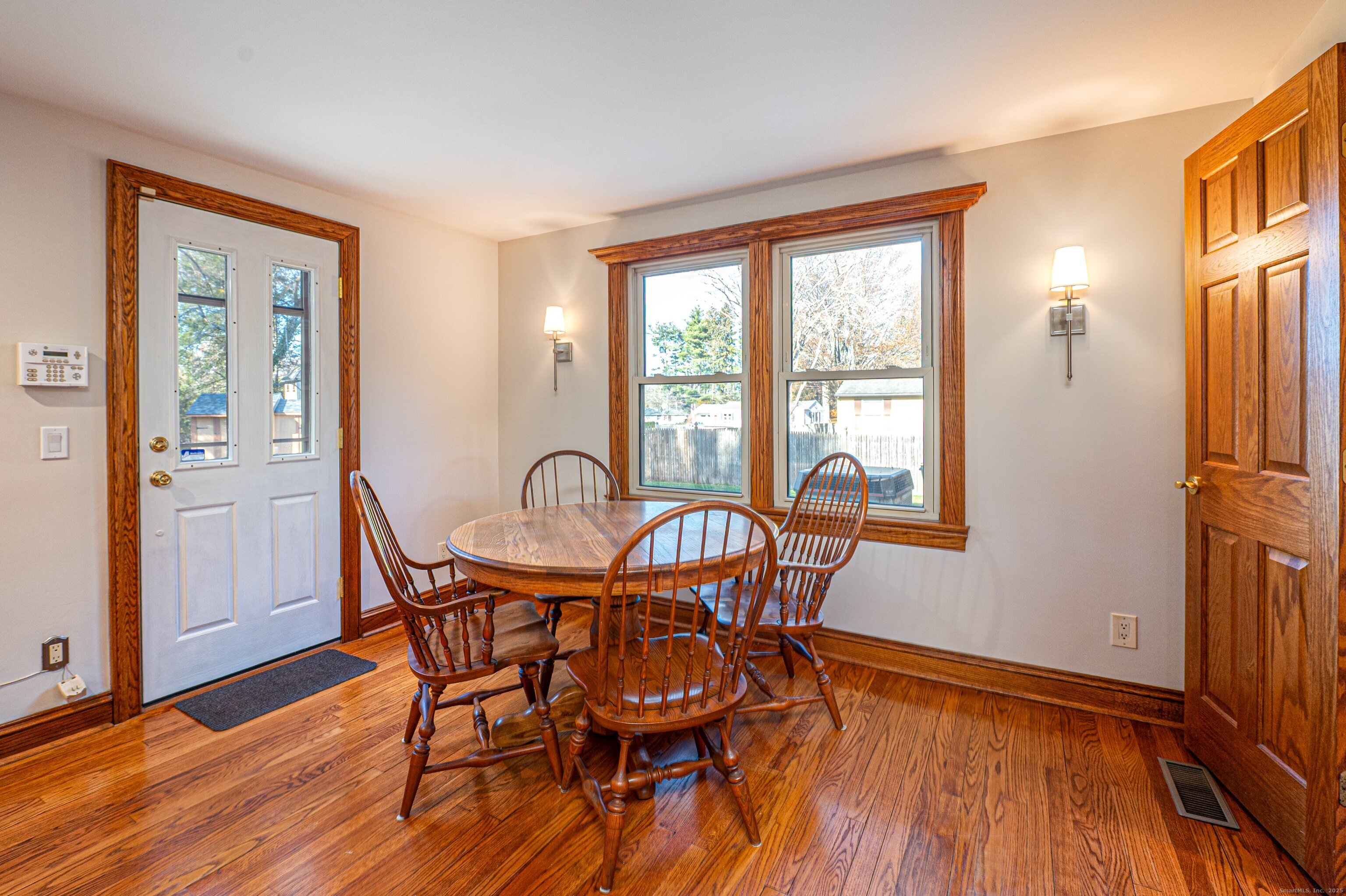 975 Wolf Hill Road Cheshire, CT 06410 - Photo 7 of 40 a view of a dining room with furniture window and wooden floor