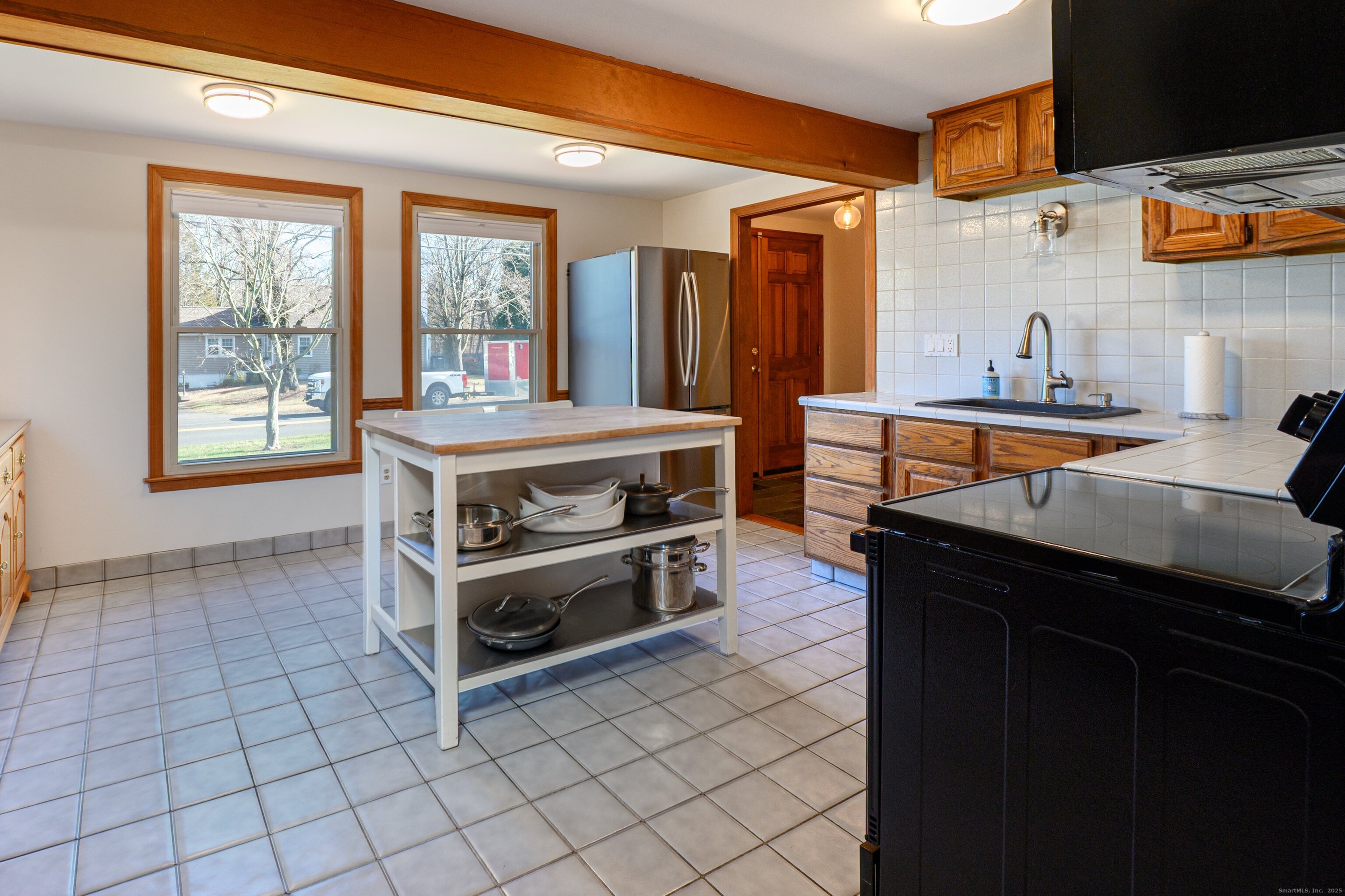 975 Wolf Hill Road Cheshire, CT 06410 - Photo 9 of 40 a kitchen with stainless steel appliances a stove a sink and a cabinets