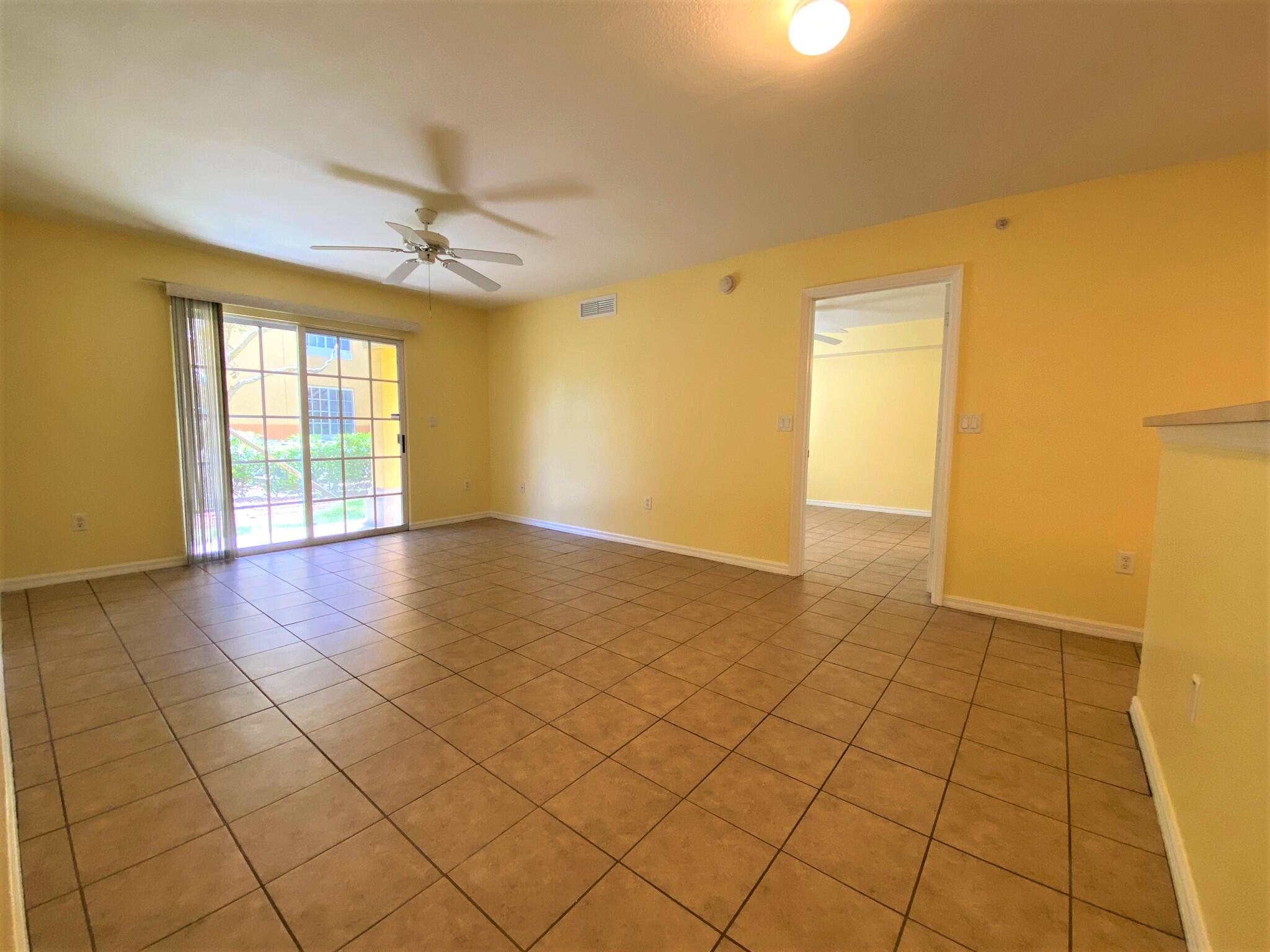 6768 Heritage Grande, Unit 106 Boynton Beach, FL 33437 - Photo 12 of 56 a view of an empty room and window