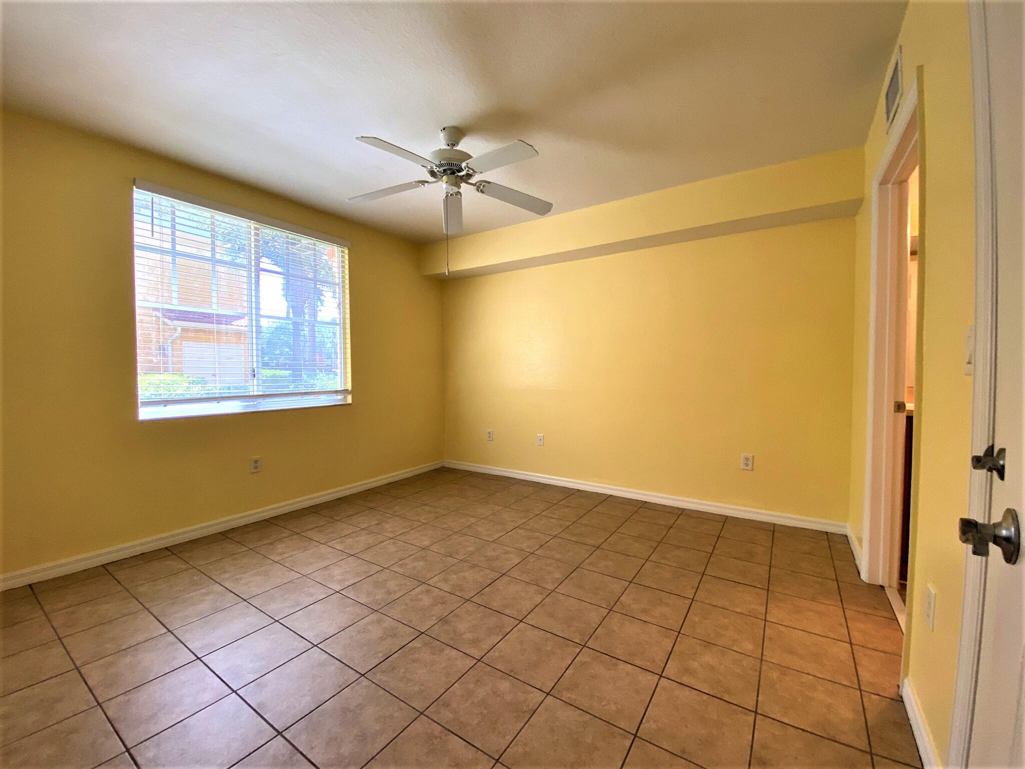 6768 Heritage Grande, Unit 106 Boynton Beach, FL 33437 - Photo 15 of 56 a view of an empty room with a window
