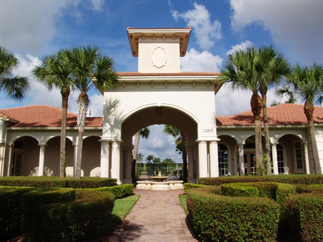 6768 Heritage Grande, Unit 106 Boynton Beach, FL 33437 - Photo 2 of 56 a front view of a house with a garden