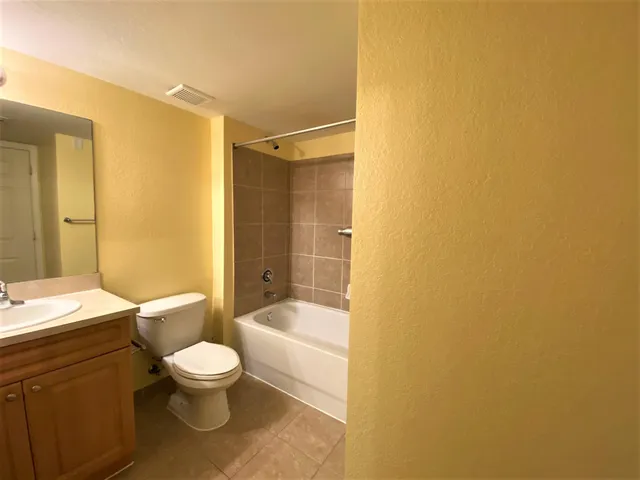 a view of a house in front of a house with yard and entertaining space