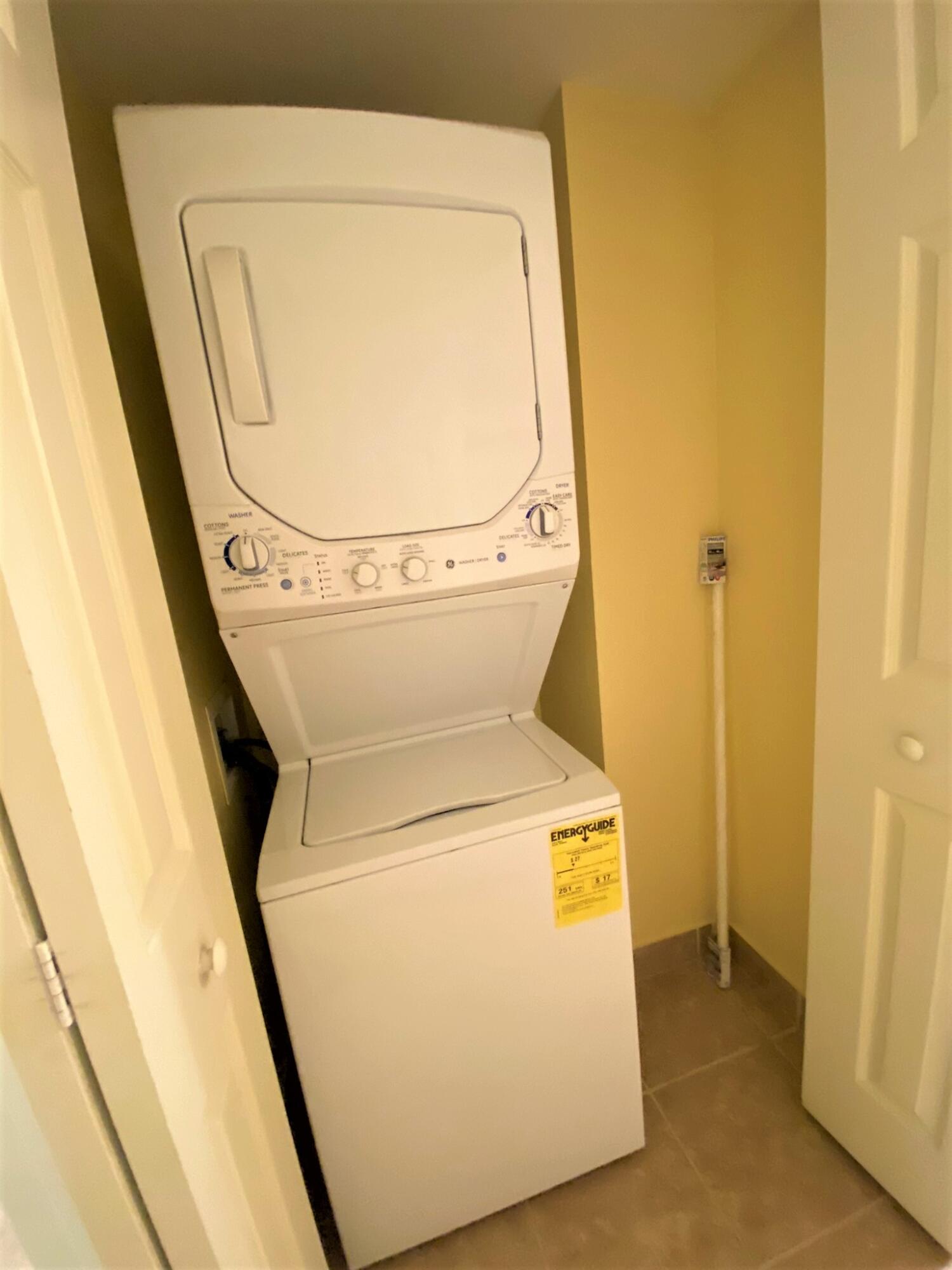6768 Heritage Grande, Unit 106 Boynton Beach, FL 33437 - Photo 28 of 56 a utility room with dryer and washer