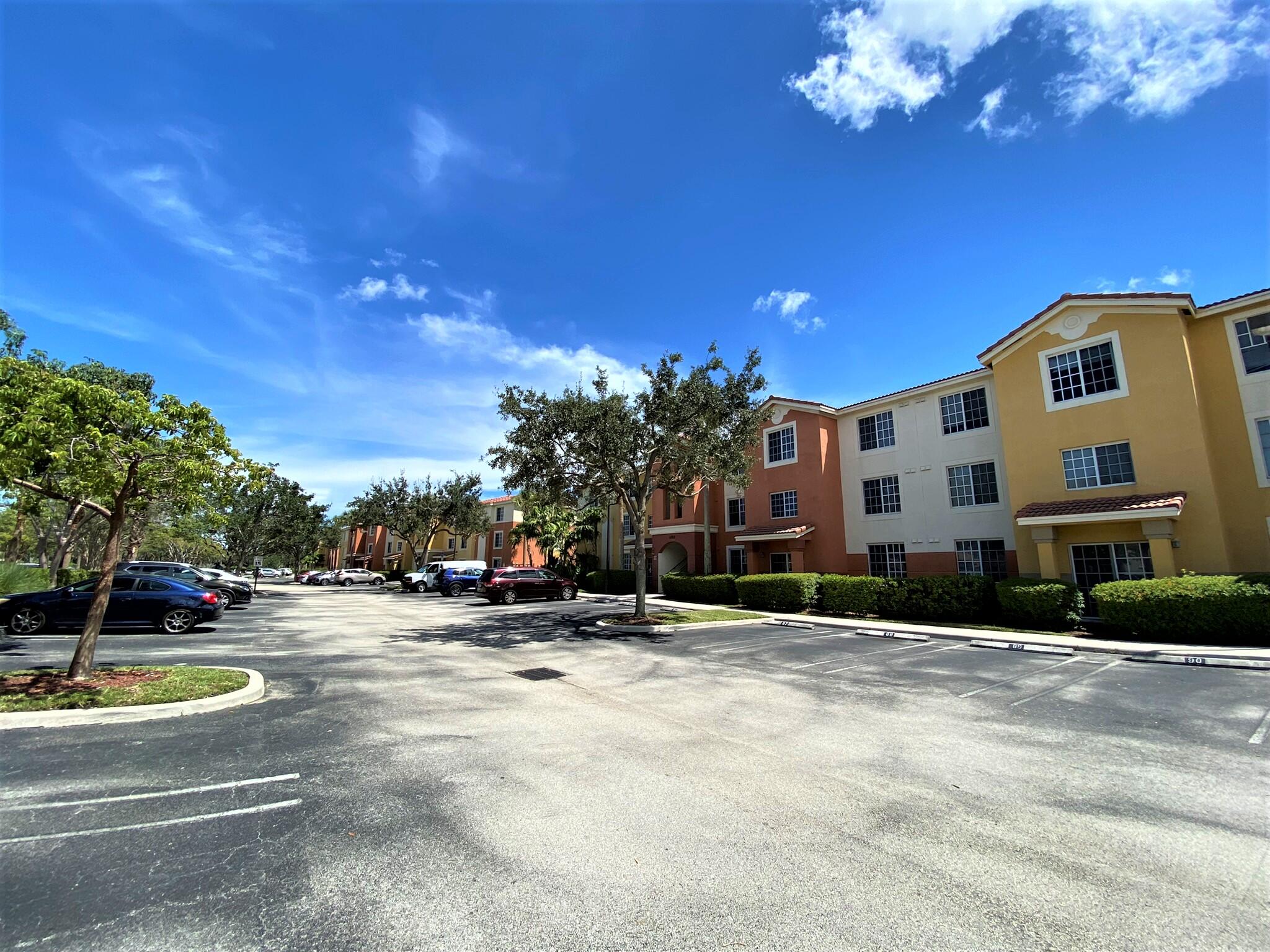 6768 Heritage Grande, Unit 106 Boynton Beach, FL 33437 - Photo 3 of 56 a view of a building with a yard