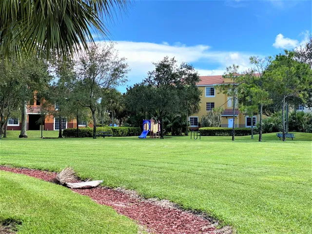 a view of a lake with houses in the back