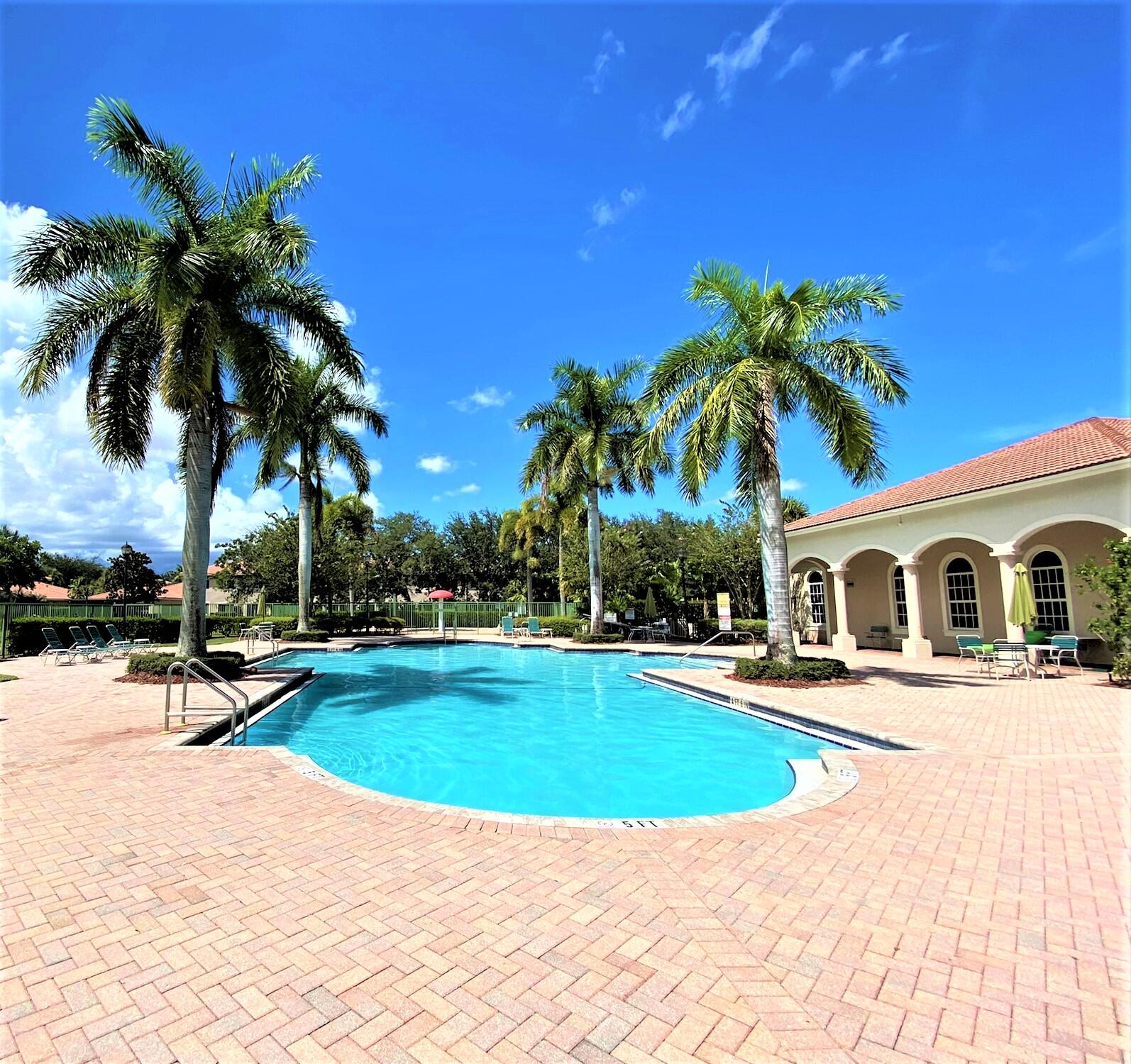 6768 Heritage Grande, Unit 106 Boynton Beach, FL 33437 - Photo 35 of 56 a view of a house with swimming pool and sitting area