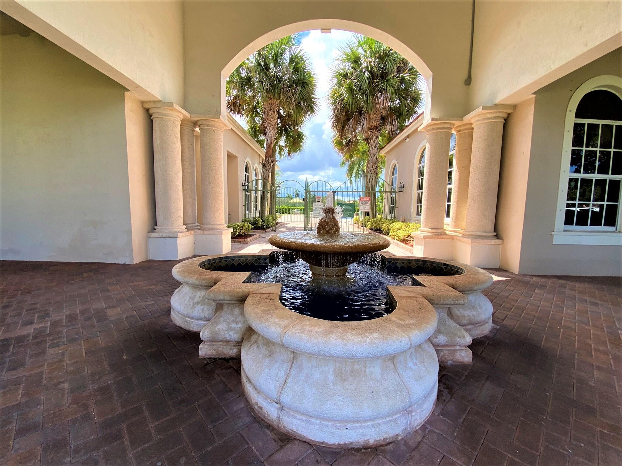 6768 Heritage Grande, Unit 106 Boynton Beach, FL 33437 - Photo 39 of 56 a view of a living room and a couch