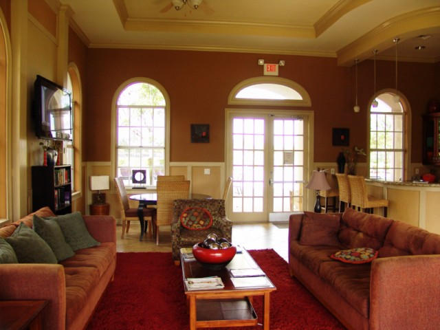 6768 Heritage Grande, Unit 106 Boynton Beach, FL 33437 - Photo 40 of 56 a living room with furniture and a large window