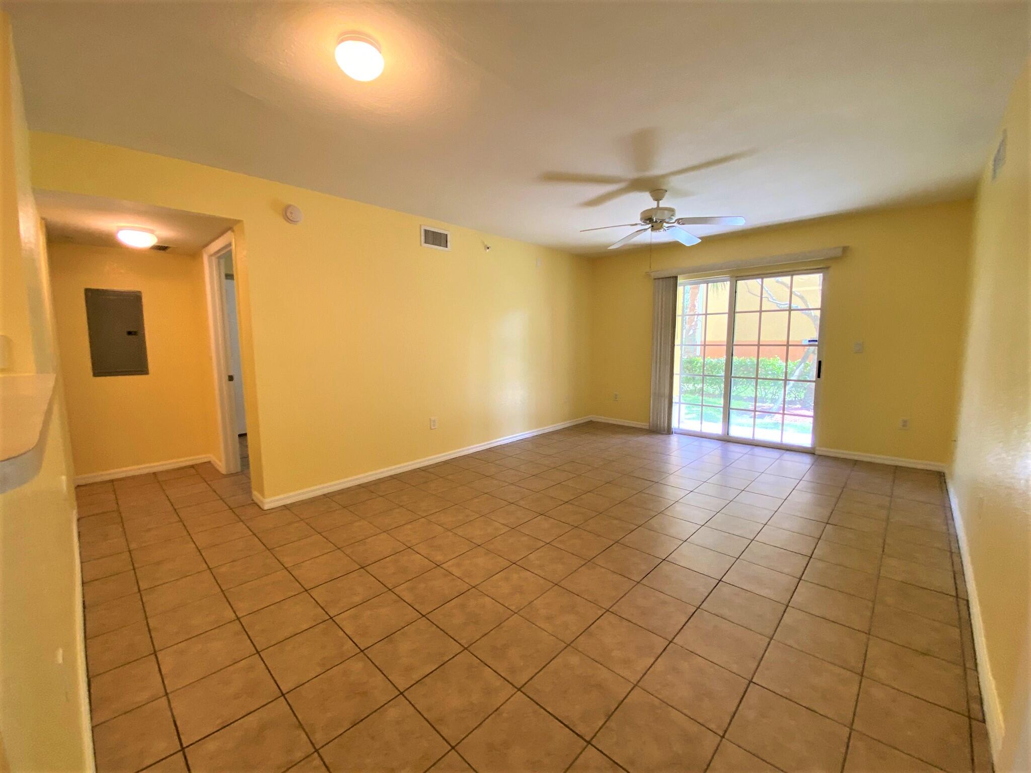 6768 Heritage Grande, Unit 106 Boynton Beach, FL 33437 - Photo 10 of 56 a view of an empty room with a window