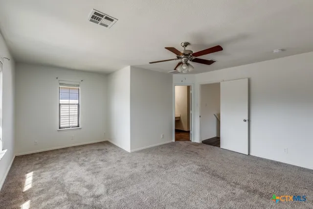 a view of a livingroom with a ceiling fan
