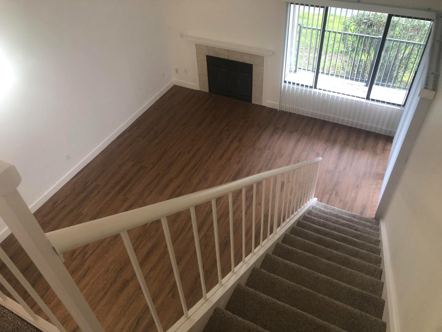 5771 Cutter Loop Discovery Bay, CA 94505 - Photo 8 of 12 a view of an empty room with wooden floor and a window
