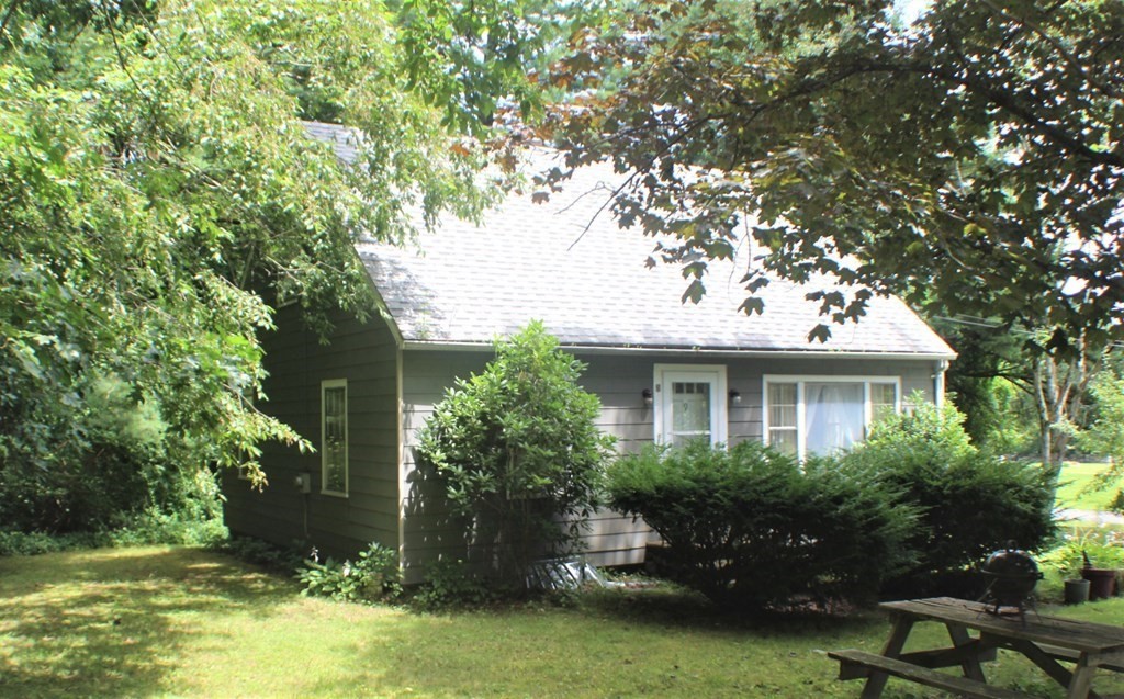 9 Jamieson Road Sturbridge, MA 01566 - Photo 3 of 27 a house with a tree in front of it