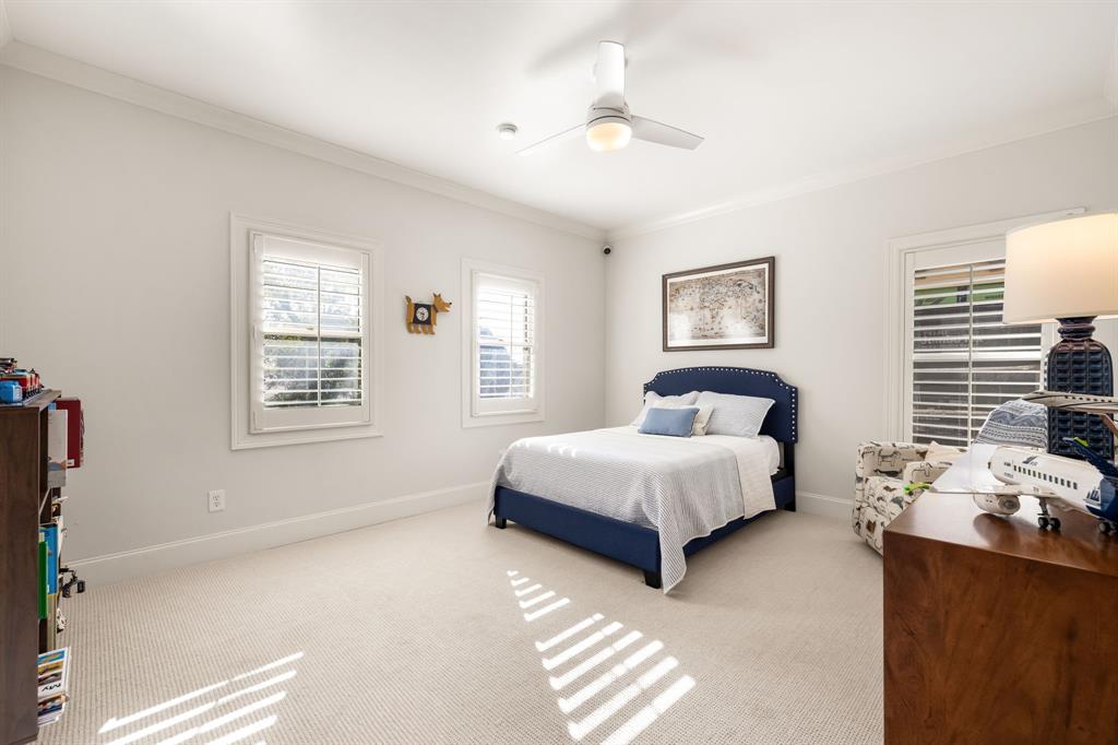 4715 Purdue Avenue Dallas, TX 75209 - Photo 16 of 30 a spacious bedroom with a bed and window
