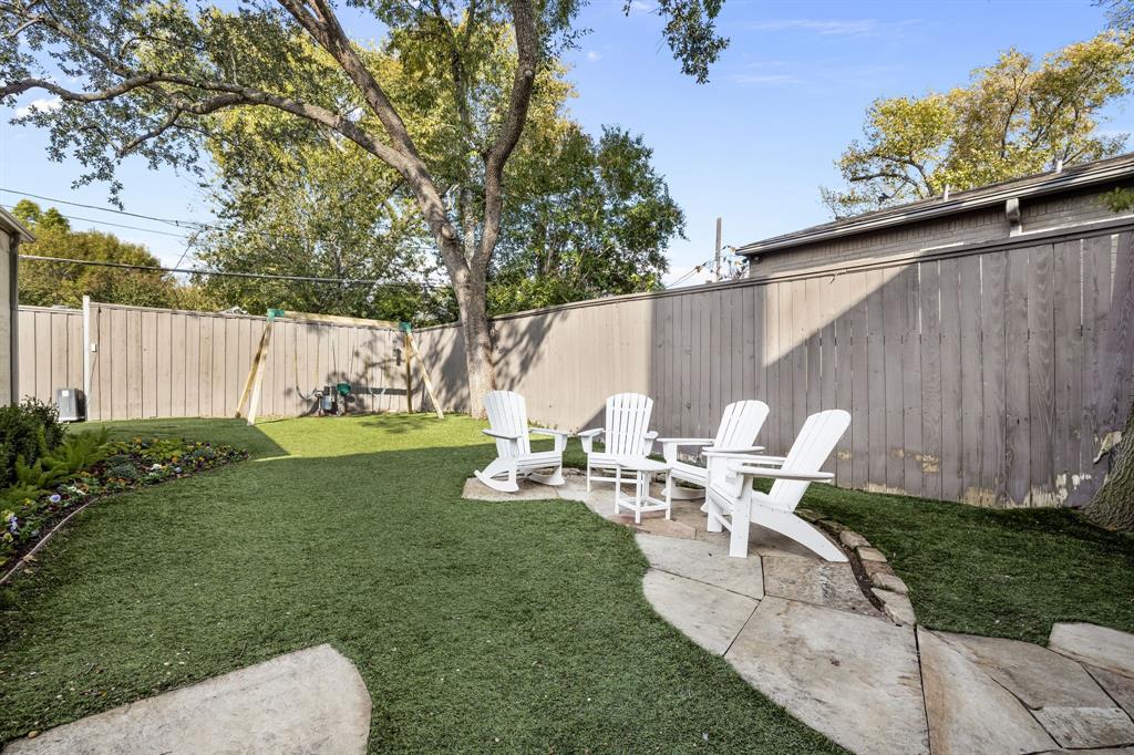 4715 Purdue Avenue Dallas, TX 75209 - Photo 28 of 30 a view of backyard of house with seating space