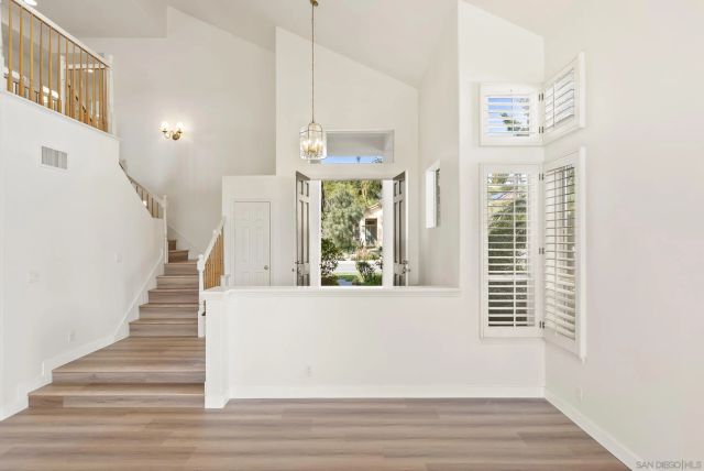 a view of an entryway with wooden floor
