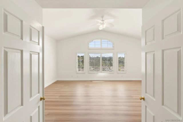 a bathroom with a window and a bathtub