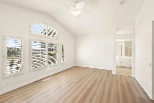 a bathroom with a bathtub and next to a window