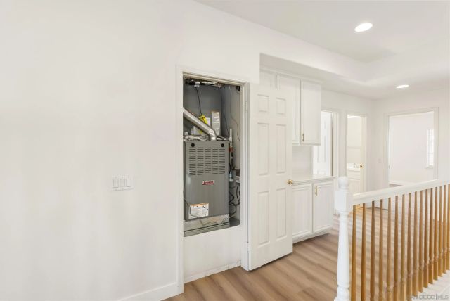 a view of a patio with a table chairs potted plants with wooden fence