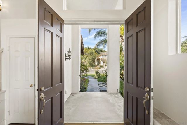 a view of an entryway with wooden floor