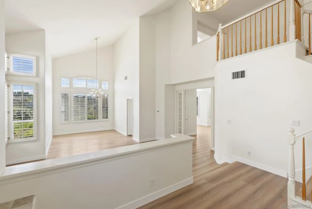 a view of hallway with wooden floor