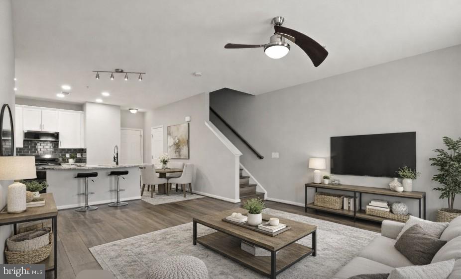 9541 Center Street Manassas, VA 20110 - Photo 11 of 41 a living room with furniture and a flat screen tv
