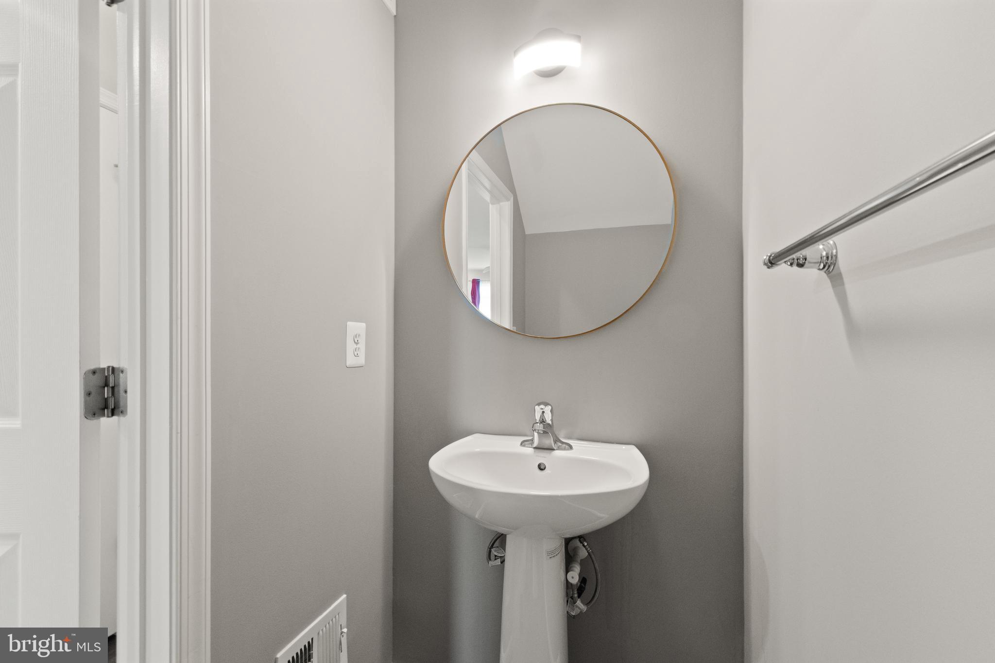 9541 Center Street Manassas, VA 20110 - Photo 14 of 41 a bathroom with a sink and a mirror