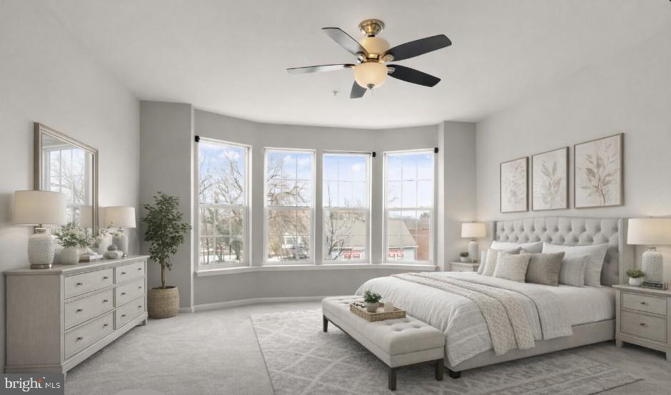 9541 Center Street Manassas, VA 20110 - Photo 27 of 41 a spacious bedroom with a large bed and a window