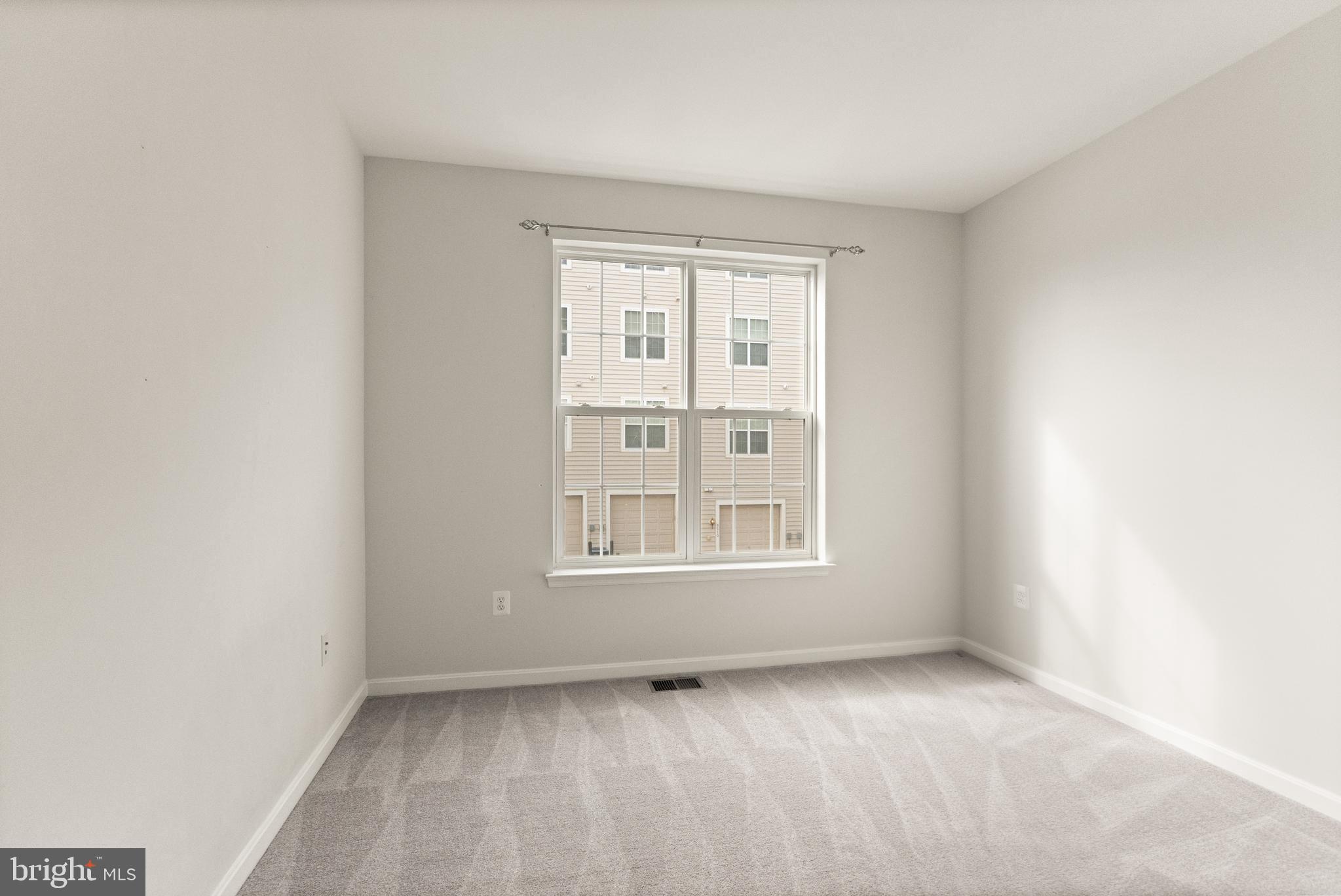9541 Center Street Manassas, VA 20110 - Photo 32 of 41 an empty room with a window